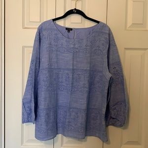 Women’s lined blouse with eyelet lace.